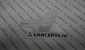 Кронштейн переднего бампера правый под фарой - Дубликат - Lancer96.ru-Продажа запасных частей для Митцубиши в Екатеринбурге